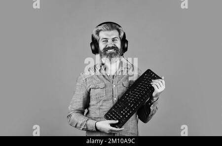 Shop gadgets. Hipster gamer headphones and keyboard. Gaming addiction. Graphics settings pushed to limit. Play computer games. Superior performance Stock Photo