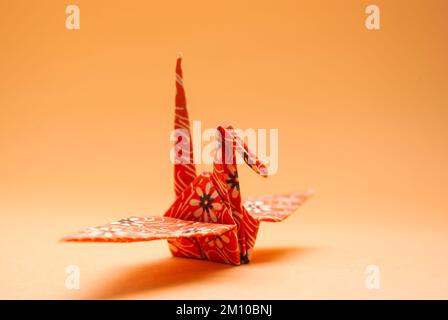 Paper crane traditionally folded according to the Japanese art of origami. Stock Photo