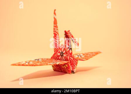 Paper crane traditionally folded according to the Japanese art of origami. Stock Photo