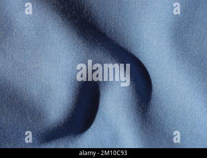 creased dark blue cotton fabric texture useful as a background Stock Photo