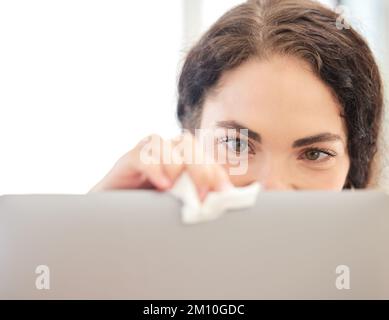 Woman, cleaning and wipe laptop in home for hygiene, health and wellness. Spring cleaning, housework and female housekeeper sanitizing computer, pc or Stock Photo