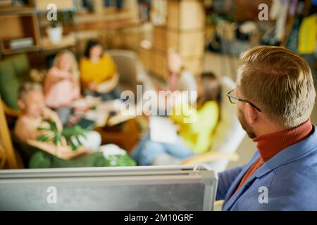 Project manager working with employees, co-workers on new projects, having meeting, discussion at the office, indoors. Concept of business Stock Photo