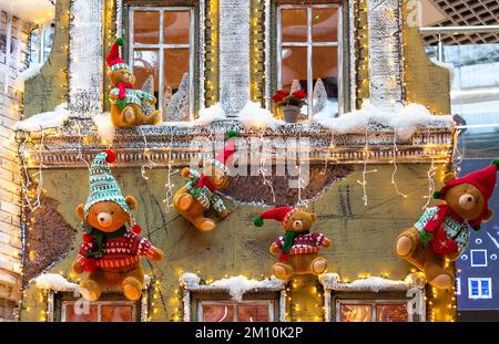 Christmas background with teddy bears on a vintage house. Beautiful vintage house decoration Stock Photo