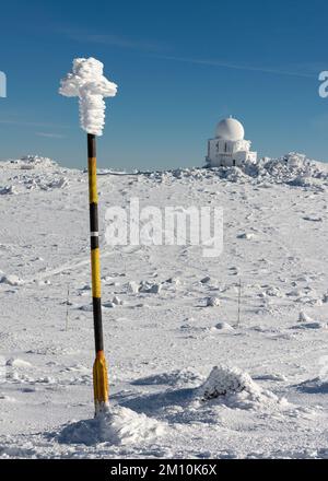 Snow level marker pole and the Doppler weather radar station near Black Peak in Vitosha Mountain near Sofia, Bulgaria Stock Photo