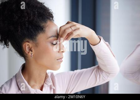 Headache, stress and burnout black woman in office feeling tired, exhausted or fatigue. Anxiety, depression and business woman with poor mental health Stock Photo