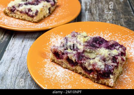 Freshly baked plum cake served on a plate. Stock Photo