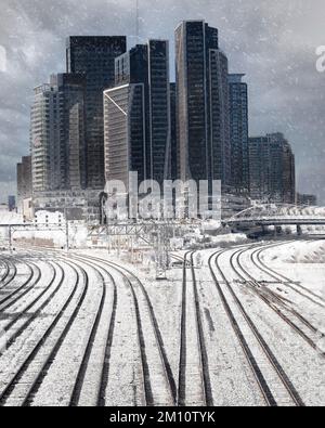 A vertical shot of highways surrounded by skyscrapers during the snowfall in Toronto, Canada Stock Photo