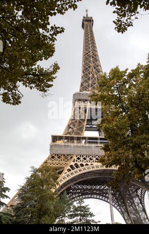 The Eiffel tower seen through the trees in Paris France Stock Photo