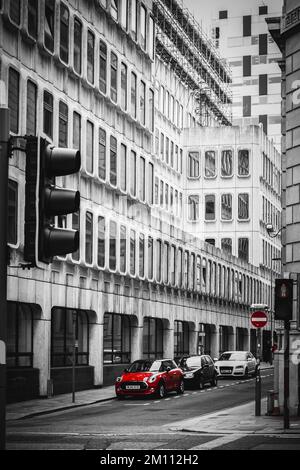 A vertical grayscale shot of a road with cars. Liverpool, England. Stock Photo