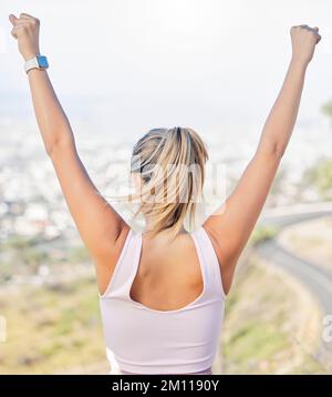 Winner, hands in air and woman exercise, outdoor and workout for wellness, health and cardio. Female athlete, healthy girl and runner victory, raised Stock Photo