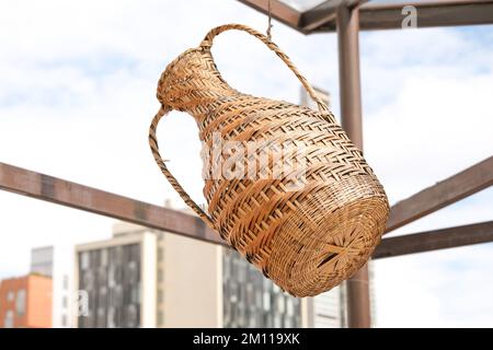 Close up straw box hanging on with city background. Stock Photo