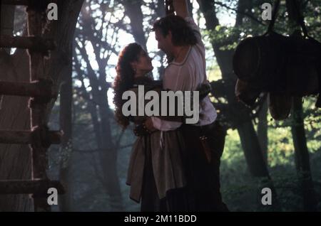 MARY ELIZABETH MASTRANTONIO as Maid Marian and KEVIN COSTNER as Robin of Locksley in ROBIN HOOD : PRINCE OF THIEVES 1991 director KEVIN REYNOLDS music Michael Kamen costume design John Bloomfield Morgan Creek Entertainment / Warner Bros. Stock Photo