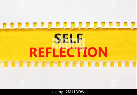 Self reflection symbol. Concept word Self reflection typed on yellow and white paper. Beautiful yellow and white background. Business psychological an Stock Photo