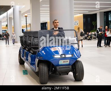 The driver drives a golf cart at the airport. VIP transport at the airport. - Istanbul - Turkey - December, 2022 Stock Photo