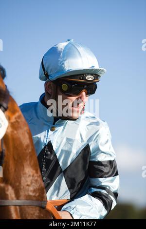 Jockey Kevin Stott waiting at the starting gates at York Races. Stock Photo