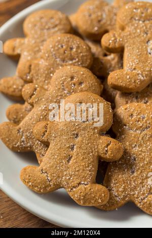 Homemade Gingerbread Men Cookies with Sugar on a Plate Stock Photo