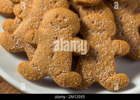 Homemade Gingerbread Men Cookies with Sugar on a Plate Stock Photo