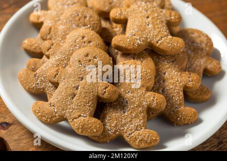Homemade Gingerbread Men Cookies with Sugar on a Plate Stock Photo