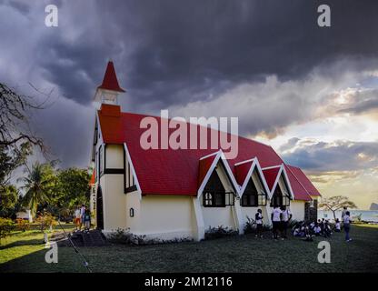 Panorama Shot of Notre Dame Auxiliatrice Church with distinctive red roof at Cap Malheureux, Mauritius Island, Indian Ocean Stock Photo