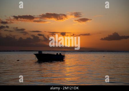 sunset at the beach of flic en flac in Mauritius Island, Africa Stock Photo