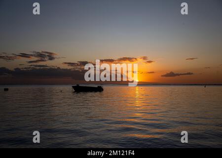 sunset at the beach of flic en flac in Mauritius Island, Africa Stock Photo