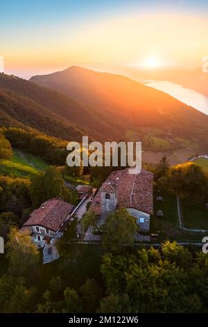 Sunset on Iseo Lake from the small church of Santa Maria del Giogo viewpoint. Sulzano, Brescia district, Lombardy, Italy. Stock Photo