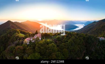 Sunset on Iseo Lake and Montisola from the small church of Santa Maria del Giogo viewpoint. Sulzano, Brescia district, Lombardy, Italy. Stock Photo