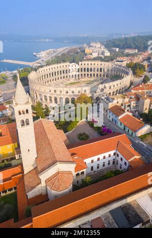 View of the St. Anthony Church and Pula Arena at sunrise. Pula, Istria, Croatia. Stock Photo