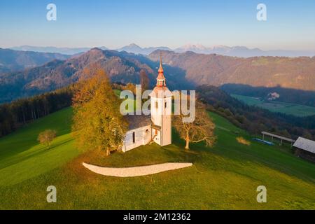 The church of Saint Thomas at sunrise. Sveti Tomaz, Skofja Loka, Upper Carniola, Slovenia. Stock Photo