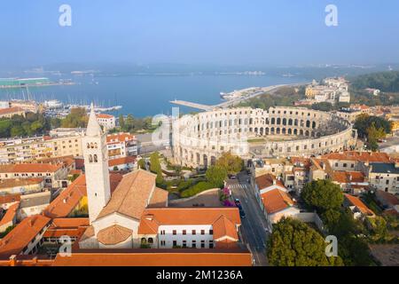 View of the St. Anthony Church and Pula Arena at sunrise. Pula, Istria, Croatia. Stock Photo