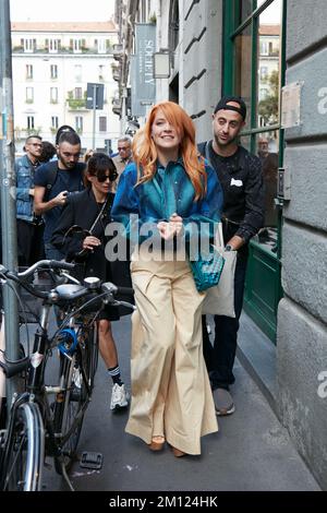 MILAN, ITALY - SEPTEMBER 21, 2022: Noemi before Alberta Ferretti fashion show, Milan Fashion Week street style Stock Photo