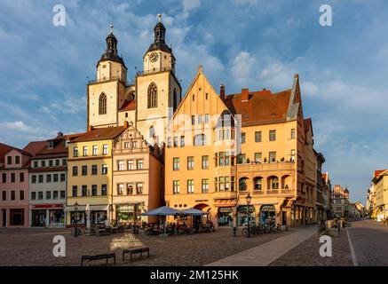 Houses on the market square, behind them the towers of the town and parish church of St. Mary. Stock Photo