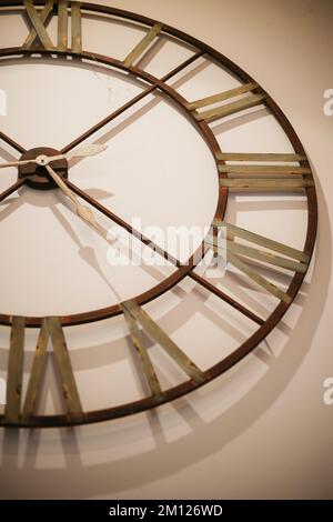 Old wall clock with Roman numerals Stock Photo