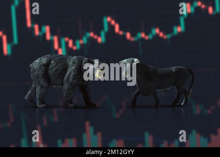 Close up shot of a Bear and bull on a stock market chart background. Stock Photo