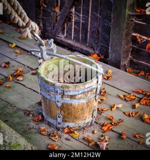 A view of an empty bucket from a dry well with no water Stock Photo