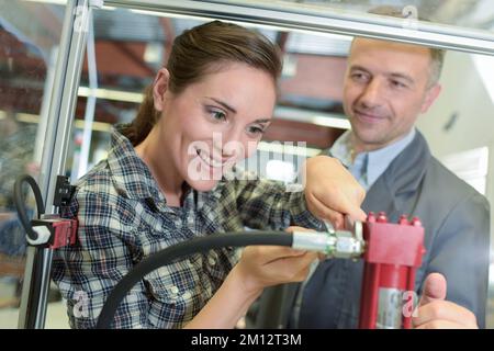 confident happy lathe factory woman employee Stock Photo