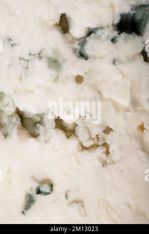 Blue cheese texture as background. A close shot of blue cheese. Macro photo. Blue cheese. Close-up Stock Photo