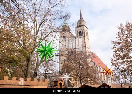 Christmas stars, Aureliosterne, Christmas market, Johanniskirche, Magdeburg, Saxony-Anhalt, Germany Stock Photo