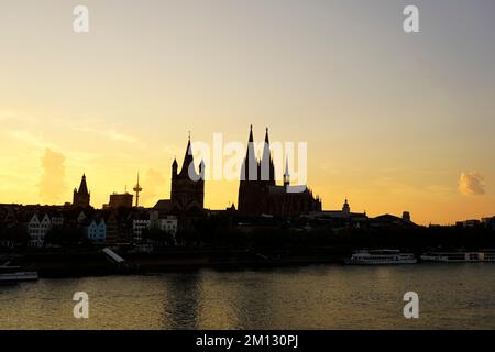 Germany, North Rhine-Westphalia, Cologne, Cologne Cathedral, church Great St. Martin, evening, sunset, silhouette Stock Photo