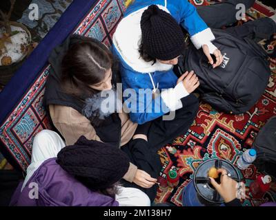 Tehran, Tehran, Iran. 9th Dec, 2022. A group of Iranian female teenagers spend their leisure time at a cafe in Darband district in northern Tehran, Iran, on December 09, 2022. (Credit Image: © Rouzbeh Fouladi via ZUMA Press Wire) Credit: ZUMA Press, Inc./17�Թ����� Live News Stock Photo