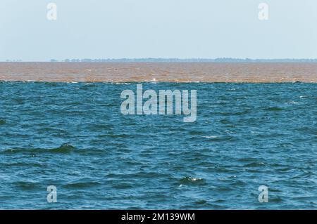 The meeting of the waters of the two rivers Amazon and Tapajos seen from the waterfront of Santarem Stock Photo
