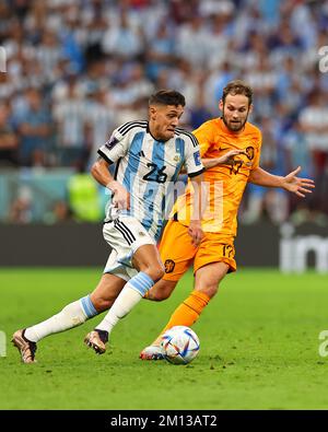 Lusail, Qatar. 9th Dec, 2022. Nahuel Molina (L) of Argentina vies with Daley Blind of the Netherlands during the Quarterfinal between the Netherlands and Argentina of the 2022 FIFA World Cup at Lusail Stadium in Lusail, Qatar, Dec. 9, 2022. Credit: Ding Xu/Xinhua/Alamy Live News Stock Photo