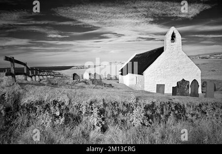 infrared landscape photograph of 6th century holycross church at Mwnt by the cardigan (ceredigion) coastal path  north ceredigion wales uk Stock Photo