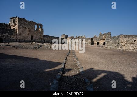 Qasr Al Azraq Castle Courtyard and Basalt Walls in Jordan Stock Photo