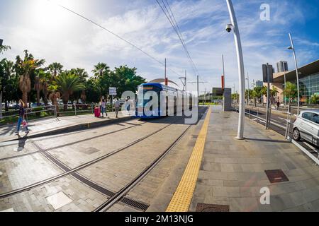 SANTA CRUZ, CANARY ISLANDS, SPAIN - OCTOBER 28, 20122: Tenerife Tram on the city street. Service started on June 2, 2007. Fisheye lens. Stock Photo