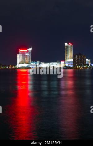 A night view of Caesar's Windsor Hotel and Casino in Windsor, Ontario, Canada, seen from Detroit across the Detroit River in Michigan, USA. Stock Photo