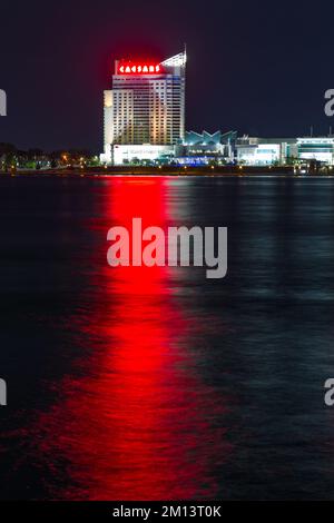 A night view of Caesar's Windsor Hotel and Casino in Windsor, Ontario, Canada, seen from Detroit across the Detroit River in Michigan, USA. Stock Photo