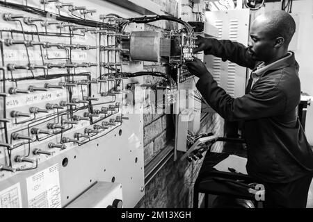 A man working on a machine at Vocational Skills Training Centre in Johannesburg in South Africa Stock Photo