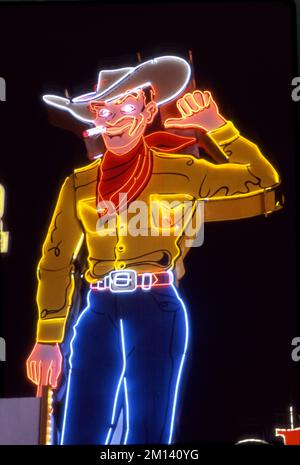 Neon cowboy sign on Fremont Street in downtown Las Vegas, NV. Stock Photo