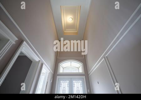 A very tall tray ceiling above the main entry way of a large house. This house has since been demolished. Stock Photo